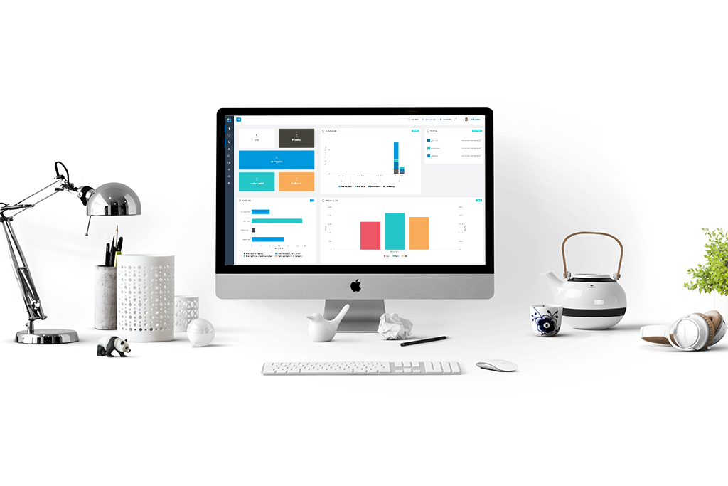 Desktop with monitor showing digilean continuous improvement statistics dashboard